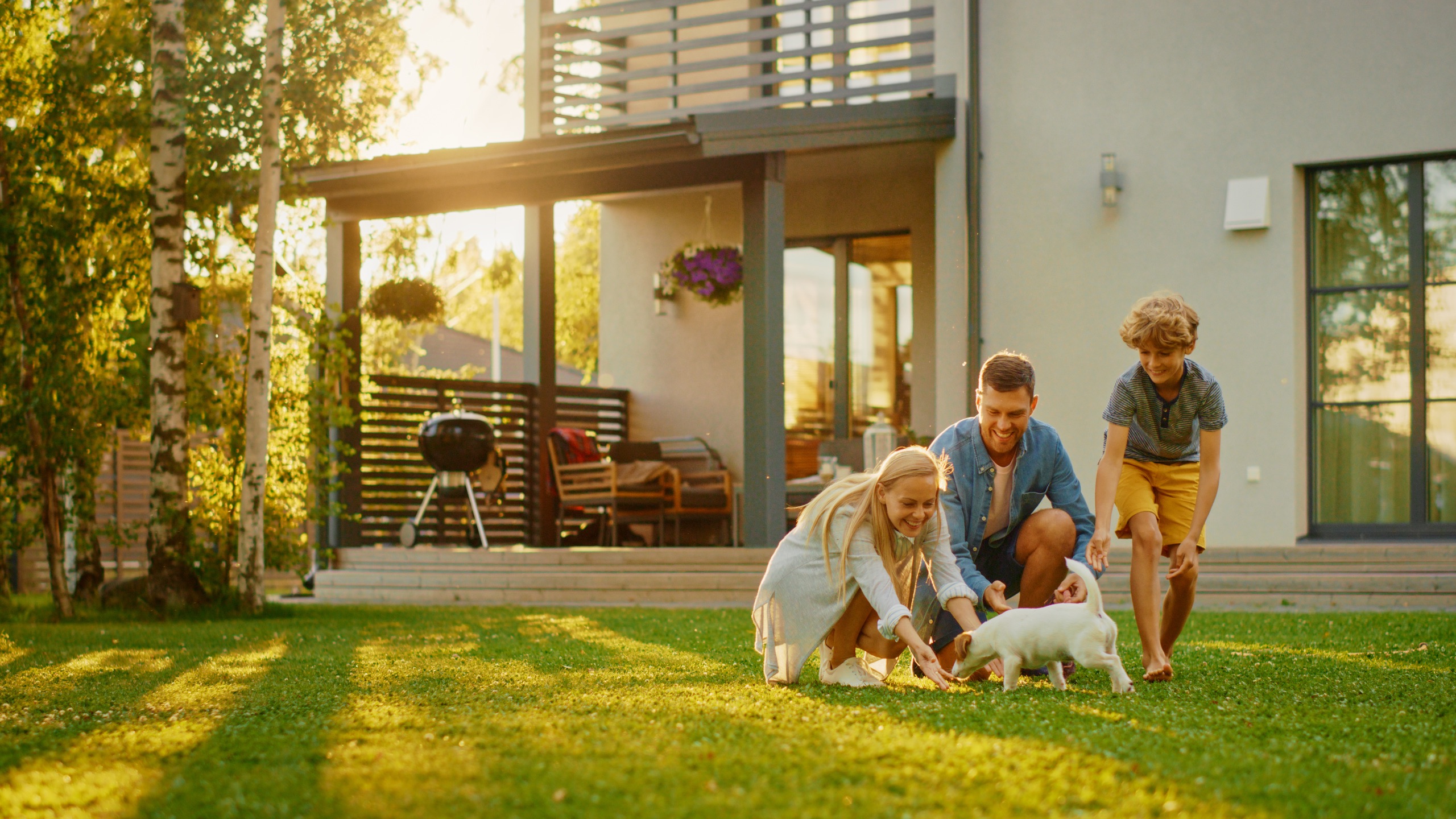 Family outside their home reviewing insurance options